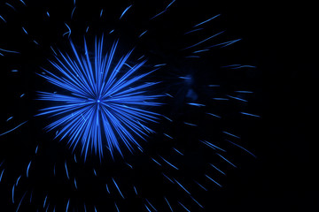Beautiful blue fireworks lighting up the night sky