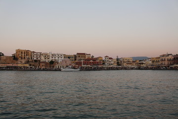 A view of old Venetian Harbor of Chania with historical buildings in Crete Island, Greece.