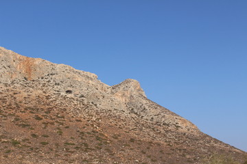 Fototapeta na wymiar Barren mountain landscape at Stavros Beach in Chania, in Crete Island, Greece.