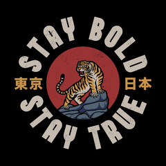 Tiger on Rocks Illustration with Stay Bold Stay True Slogan and Japan and Tokyo Words with Japanese Letters Vector Artwork for Apparel and Other Uses