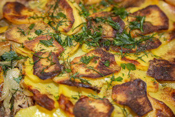 The meat is baked with onions and potatoes in a faience bowl. French cuisine