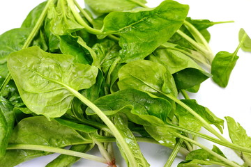 Fresh green spinach isolated on white background. Green spinach leaves. Green food.