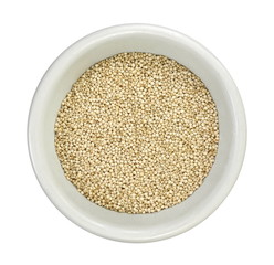 Organic Quinoa (Chenopodium quinoa) seeds in a white bowl isolated on white background. Macro close up. Top view. quinoa seeds isolated on white background.