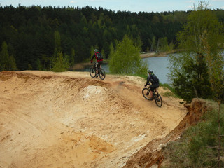 MTB riders on the sand uphill