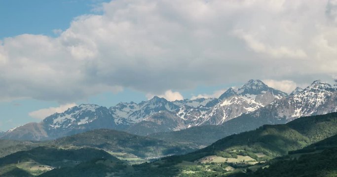 4k Morning Time lapse for big clouds passing over Chamrousse Mountain with beautiful shadows over the ground at Grenoble Alps.