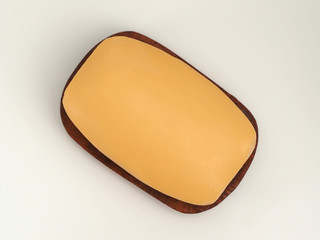 A single bar of antibacterial soap on a brown wooden dish, white background. Top view..