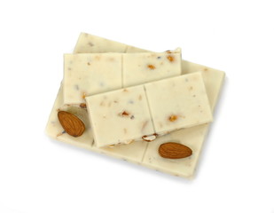 White chocolate pieces with pistachios and almonds isolated on white background.