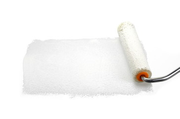 Painting a rough wall with roller. Paint roller leaving stroke of white color over a rustic background. usable for text and messages.