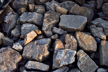 Fototapeta na wymiar A dike of stone with a textured background