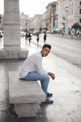 Obraz premium Nice boy posing in Rome during a sunny day untile the sunset