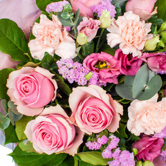 Pink bouquet of flowers from roses, carnations and lisianthus. 