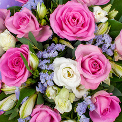Pink bouquet of flowers from roses, carnations and lisianthus. 