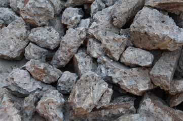 pile of stone, mountain stones, rubble and blocks close-up, ore mining, construction