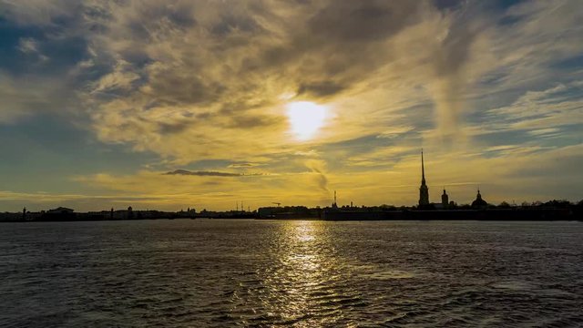 Russia, Saint Petersburg, Peter and Paul fortress and the Neva river at sunset in spring. Urban landscape. Time Lapse.