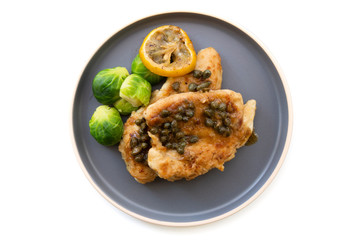 Italian food Lemon chicken Piccata  with Brussels Sprouts