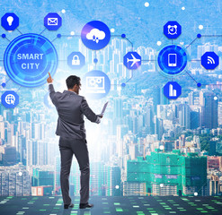 Concept of smart city with businessman pressing buttons