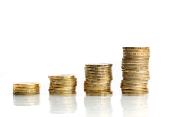 Columns of stacked coins showing growing graph. Invesment and savings concept