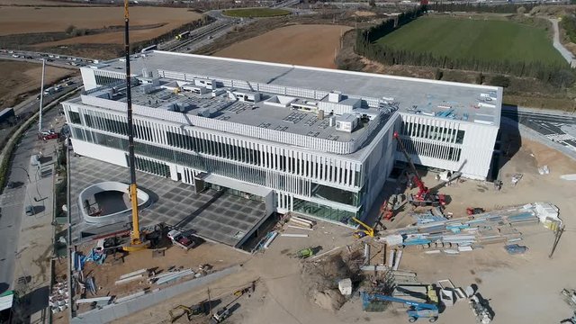 Aerial Drone Orbit view of construction site of building with special architecture design