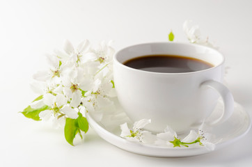 White cup of coffee on a white background, white spring