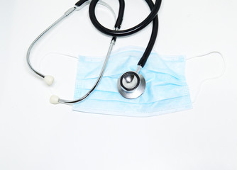 Medical disposable masks with elastic band and stethoscope Isolated on white background