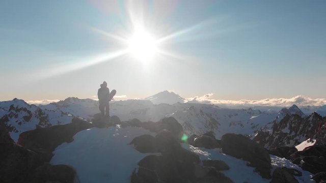 Snowboarder On the Top of a Mountain Drone Shot