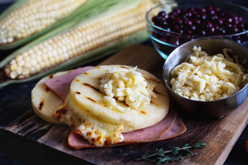 Cheese arepa with ham and grains like beans. Typical food of Colombia and Venezuela