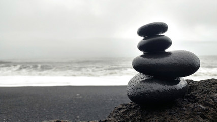 Fototapeta na wymiar zen stack of stones on the Vik blackbeach, Iceland