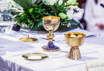 altar with host and chalice with wine in the churches of the pope of rome, francesco