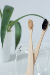 wooden toothbrush in a glass