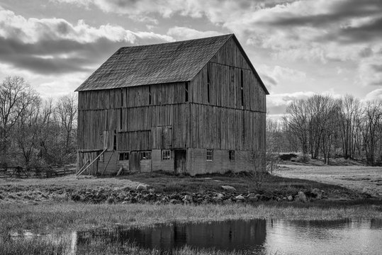 Rural black and white landscapes featuring old barns and farmland with sky and sunset.  Ontario Canada