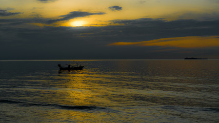 Fototapeta premium Boats at achor in the Gulf of Thailand at sunset