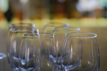 close up many empty drinking glass.  blur background