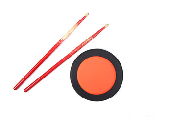 drumsticks and drum practice pad isolated on white background flat lay