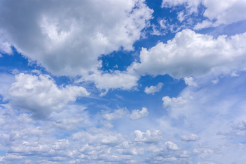 blue sky is covered by white clouds .