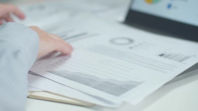 Worker removes clutter in the workplace. Close-up