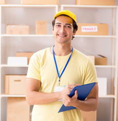 Handsome contractor working in box delivery relocation service