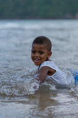 Boy on the beach, happy african american family, happy african american family on vacation