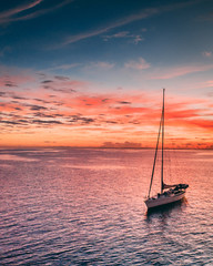 Sailboat shot at sunrise tight