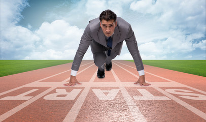 Businessman taking low start to running