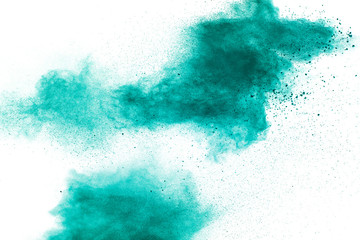 Abstract splash of green colored powder on white background.Green powder explosion.