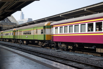 Naklejka premium vintage train. diesel locomotive train stop at public station. old railway station with trains and railway. vintage transportation