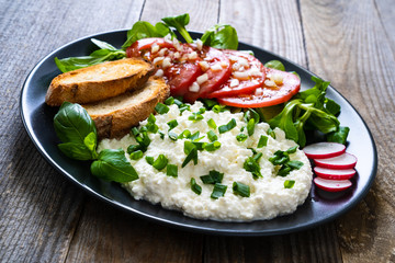 Breakfast - cottage cheese, toasted bread and vegetables
