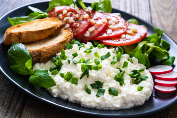 Breakfast - cottage cheese, toasted bread and vegetables
