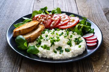 Breakfast - cottage cheese, toasted bread and vegetables
