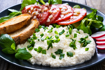 Breakfast - cottage cheese, toasted bread and vegetables
