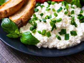 Breakfast - cottage cheese, toasted bread and vegetables
