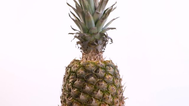  Tilt Down of Whole Pineapple Rotating
