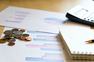 Blurred selective focus, Cost reduction calculating on financial, tax and business infographic graph pie chart. Tax and expense cost saving for personal. Economic crisis during Covid-19 pandemic