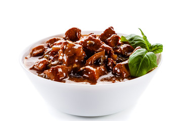 Goulash - roast meat in sauce on white background
