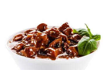 Goulash - roast meat in sauce on white background
